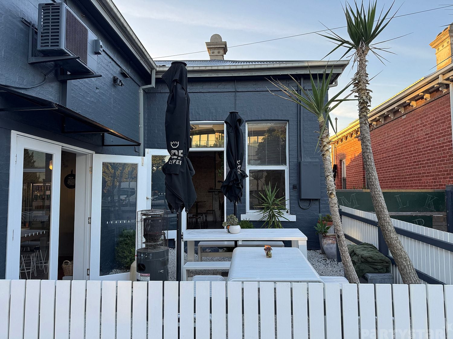 Dining room and courtyard function space at Mother Cafe Caulfield, Caulfield North, VIC. Photo 5